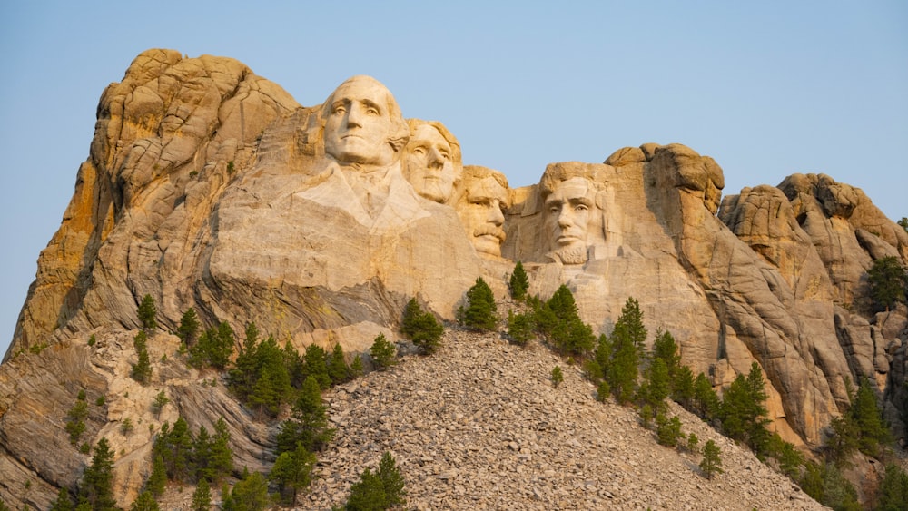 a group of presidents carved into the side of a mountain