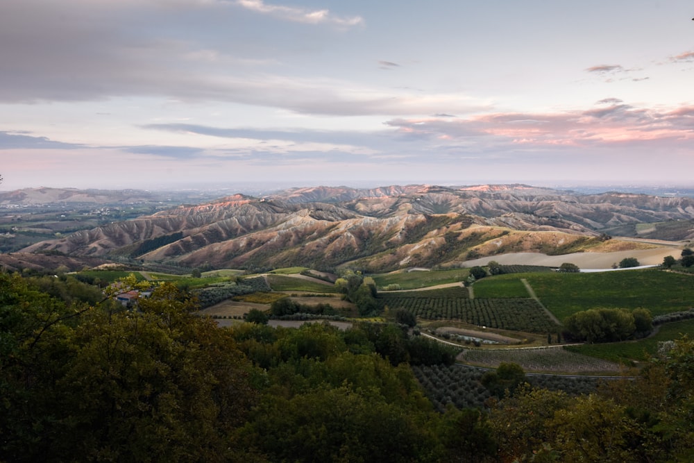 a scenic view of a valley and mountains