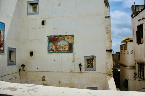 A white building with a painting on the side of it — Algiers, Algeria