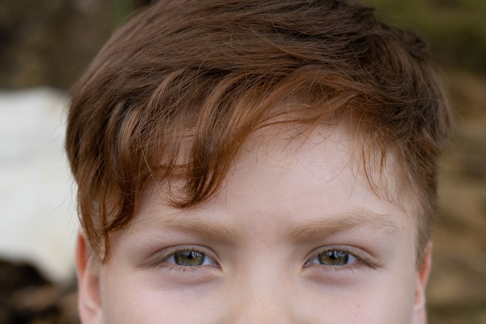 a close up of a child with a toothbrush in his mouth