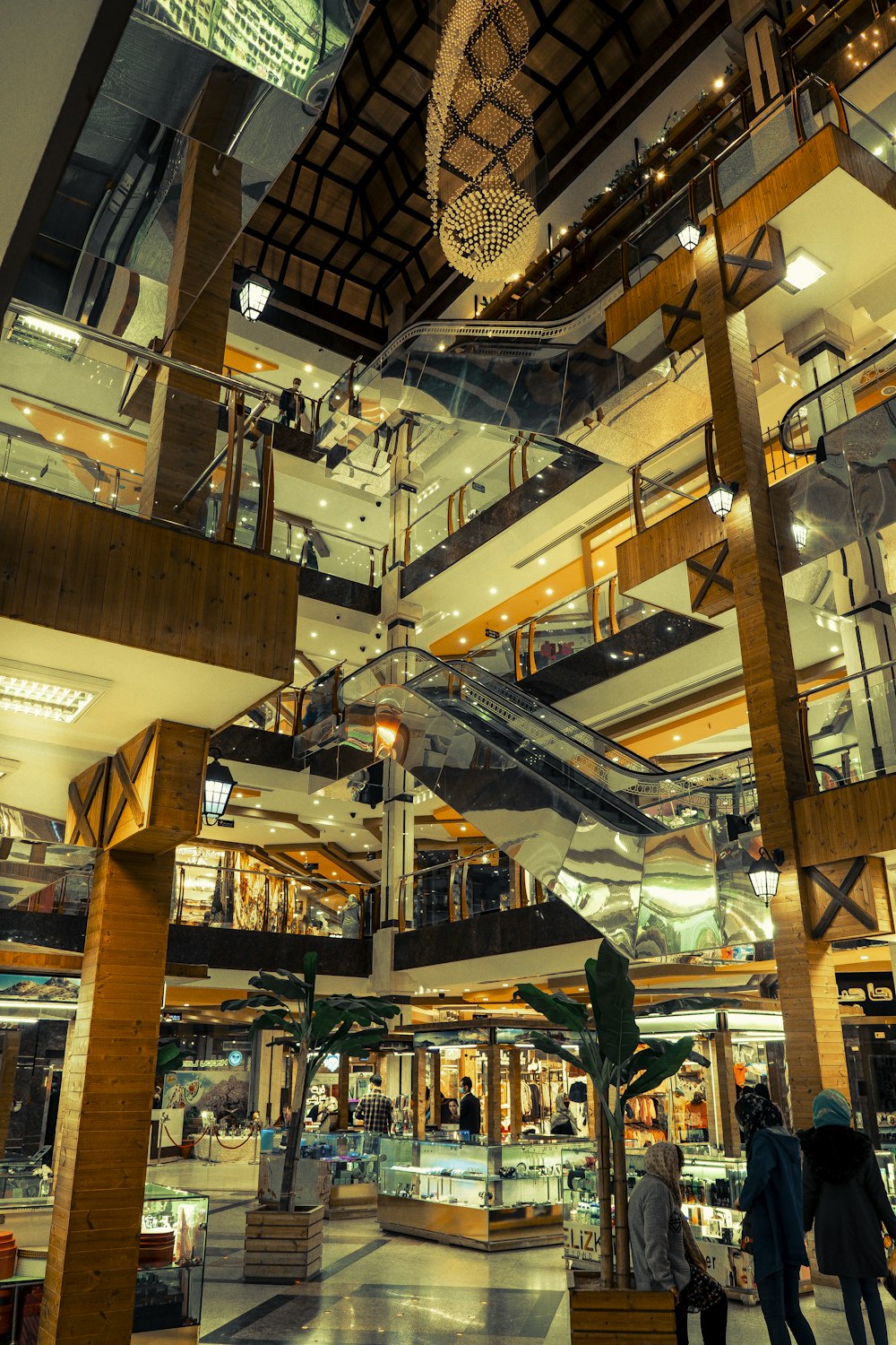 a group of people walking around a mall