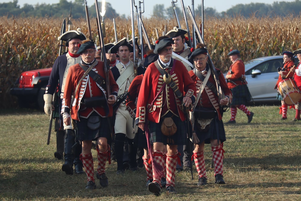 a group of men dressed in period costumes