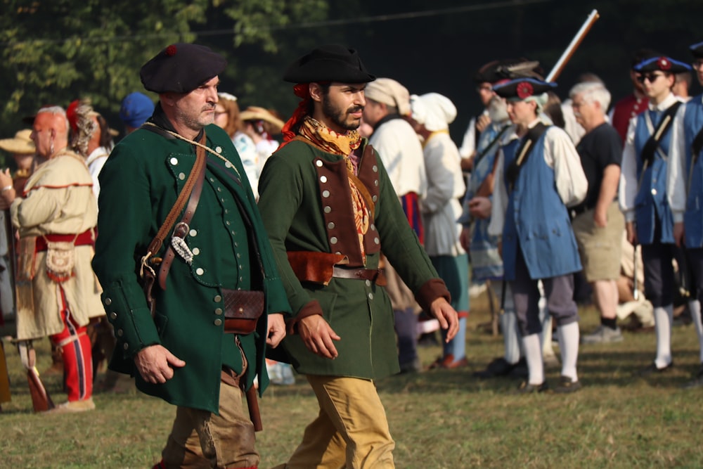 a group of men dressed in period costumes