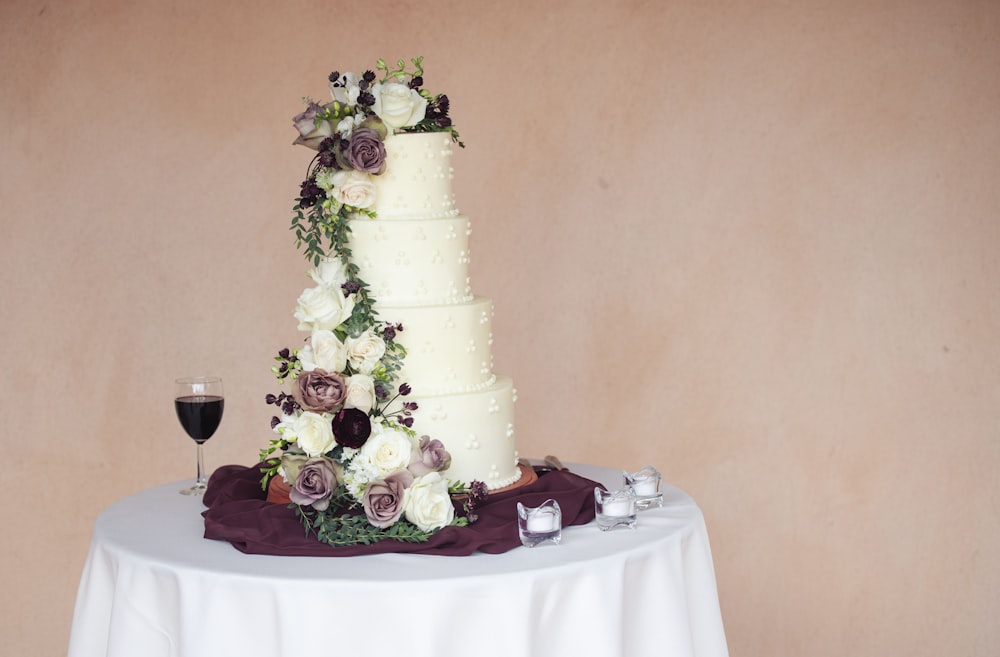 a wedding cake with flowers on a table