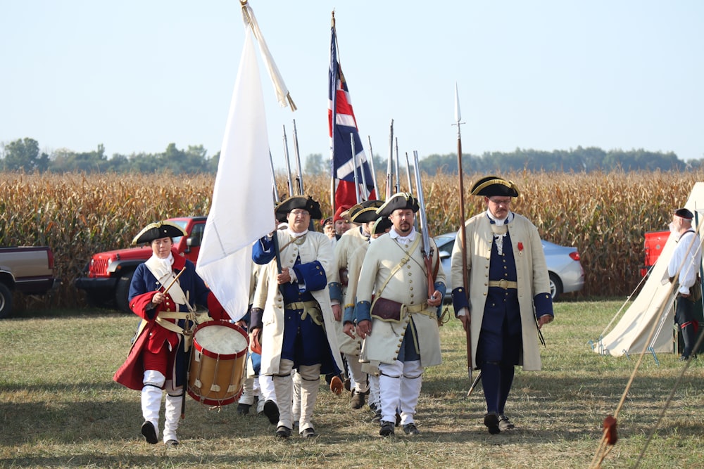 a group of men dressed in colonial clothing