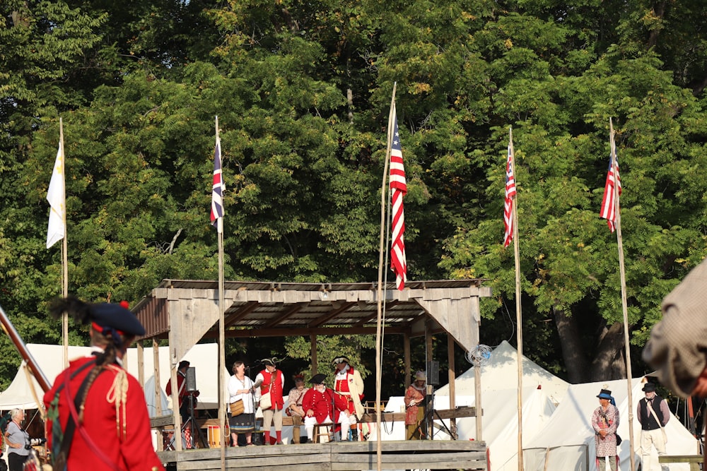 a group of men in red uniforms standing next to each other