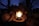 A happy customer using an LED lantern outdoors.