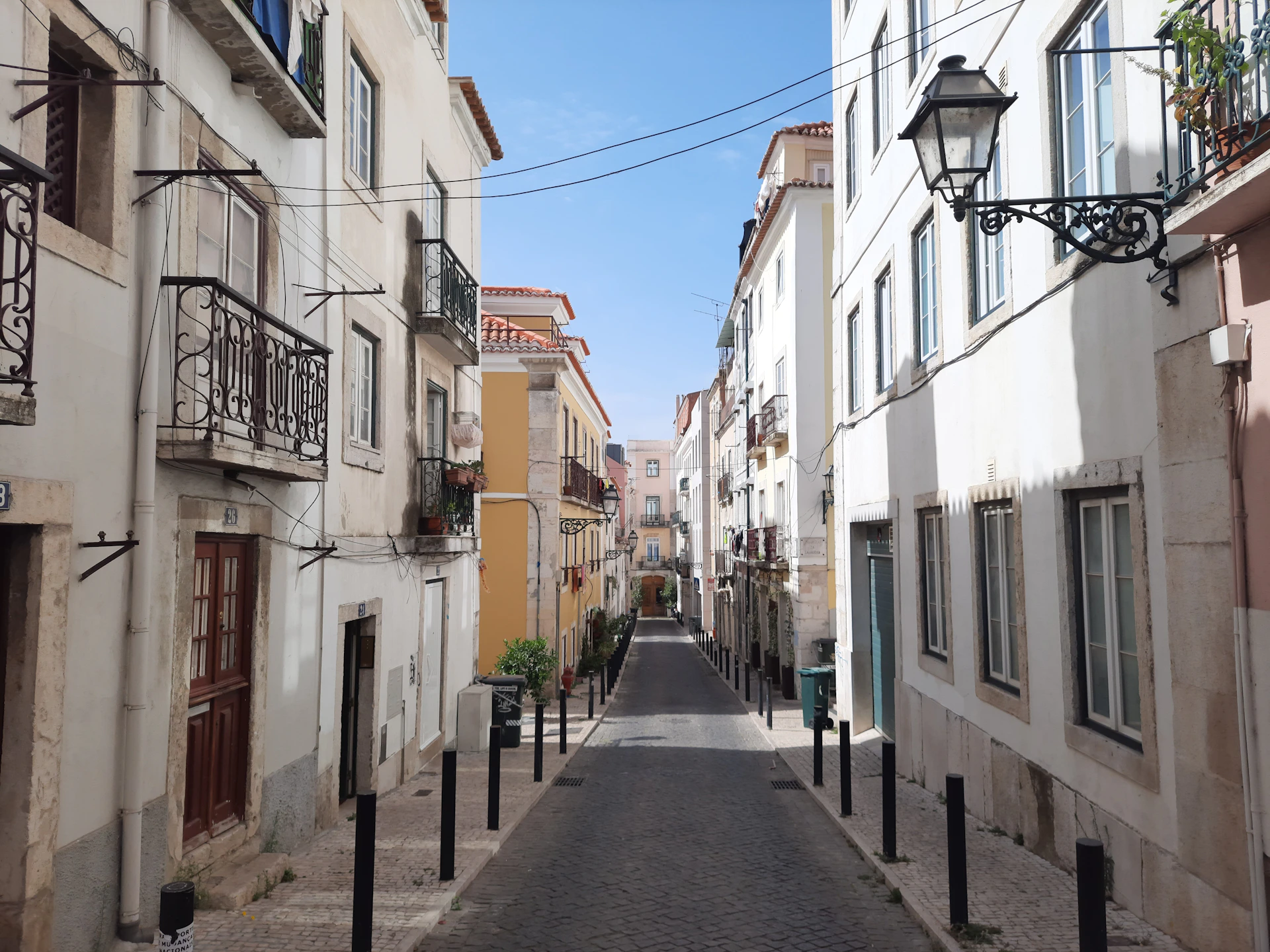 a narrow city street lined with buildings