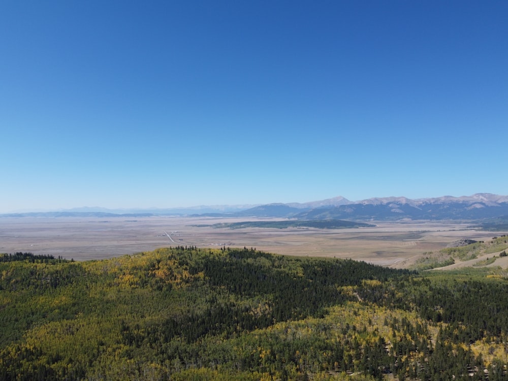 a scenic view of a valley and mountains