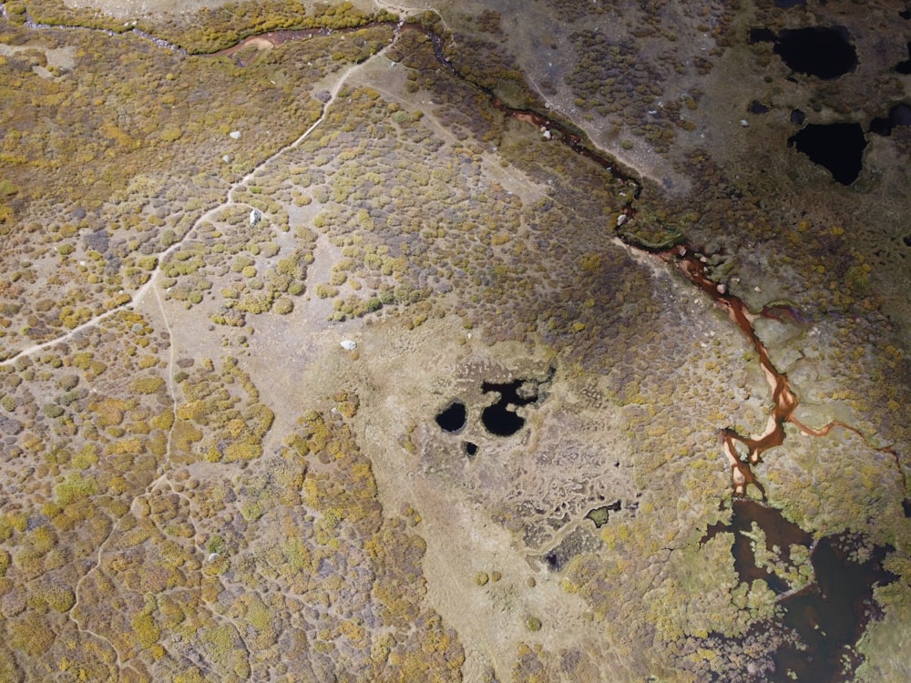 an aerial view of a rock with a hole in it