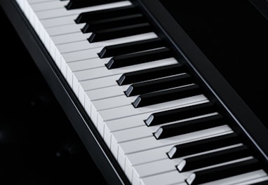 a close up of a piano keyboard on a table