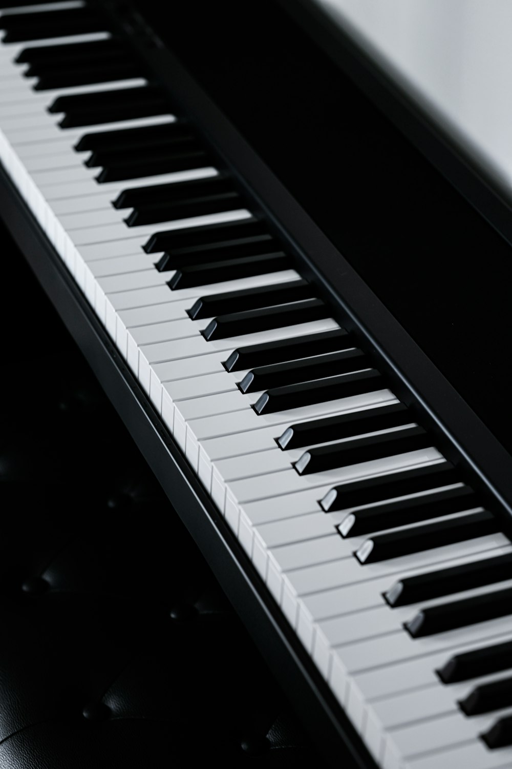 a close up of a piano keyboard on a table