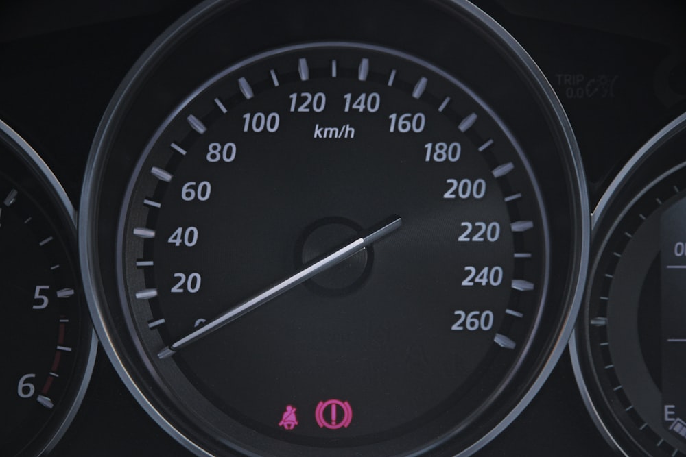 a close up of a speedometer on a car