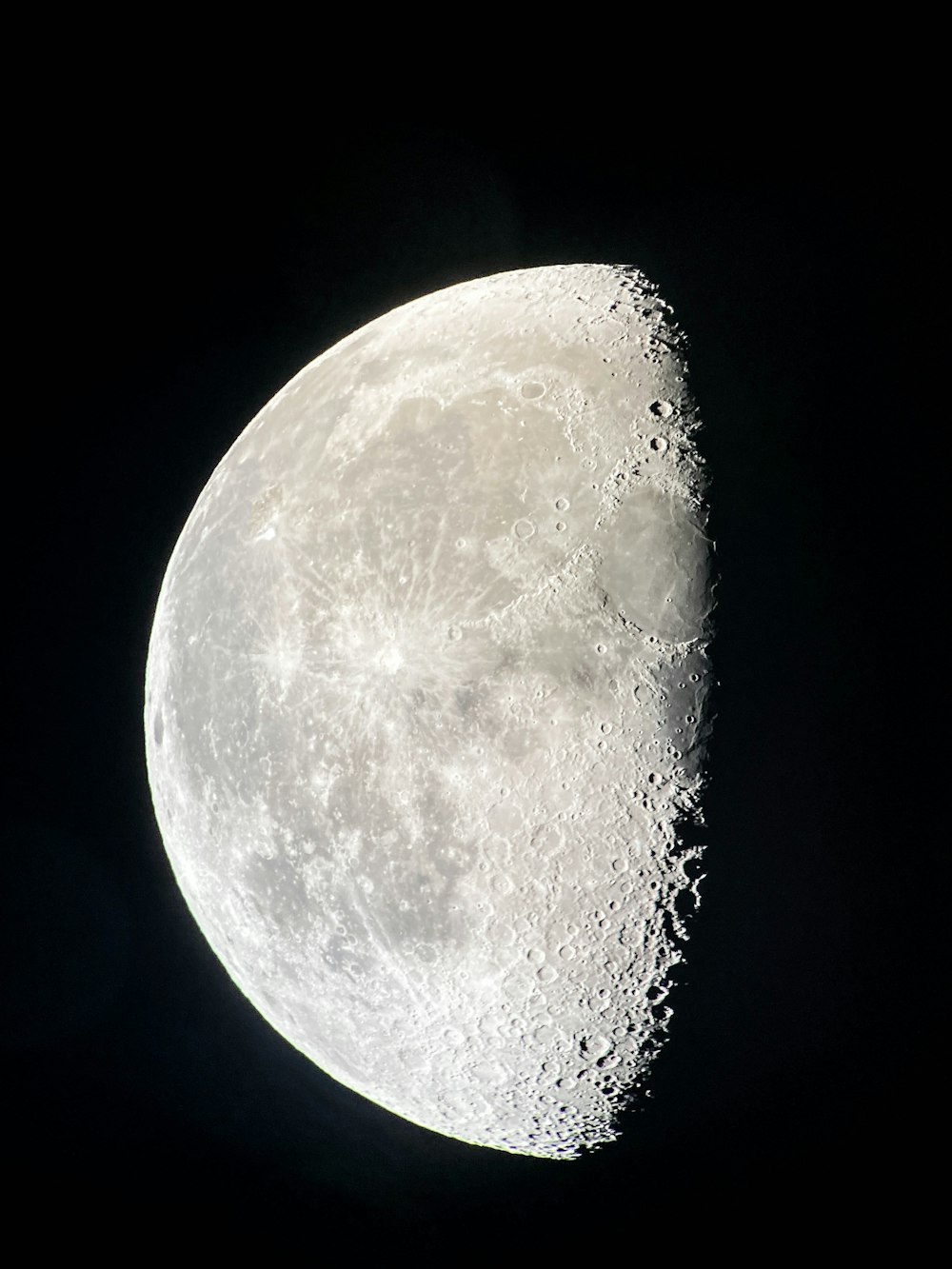 a close up of the moon in the dark sky