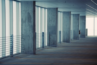 an empty parking garage filled with lots of windows