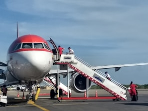 a large jetliner sitting on top of an airport tarmac