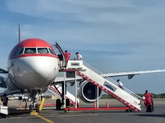 a large jetliner sitting on top of an airport tarmac