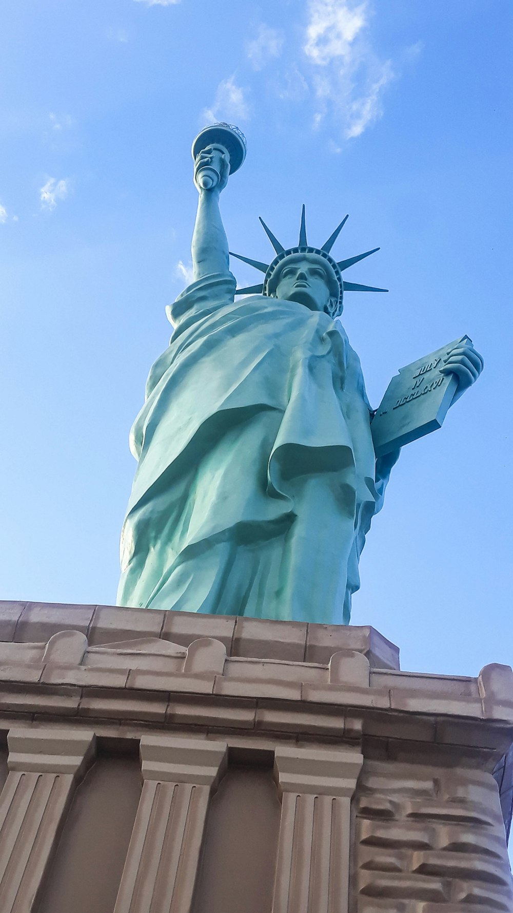 a view of the statue of liberty from below