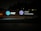 An illuminated signboard displays the AT&T logo, the wording 'AT&T University,' and an emblem with the text 'AT&T University Established 2009.' The sign is positioned outside against a background of trees, and the setting appears to be at night.