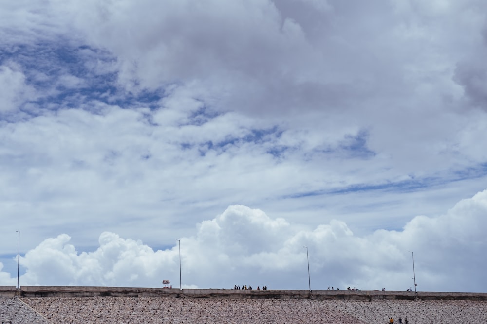 a group of people standing on top of a roof