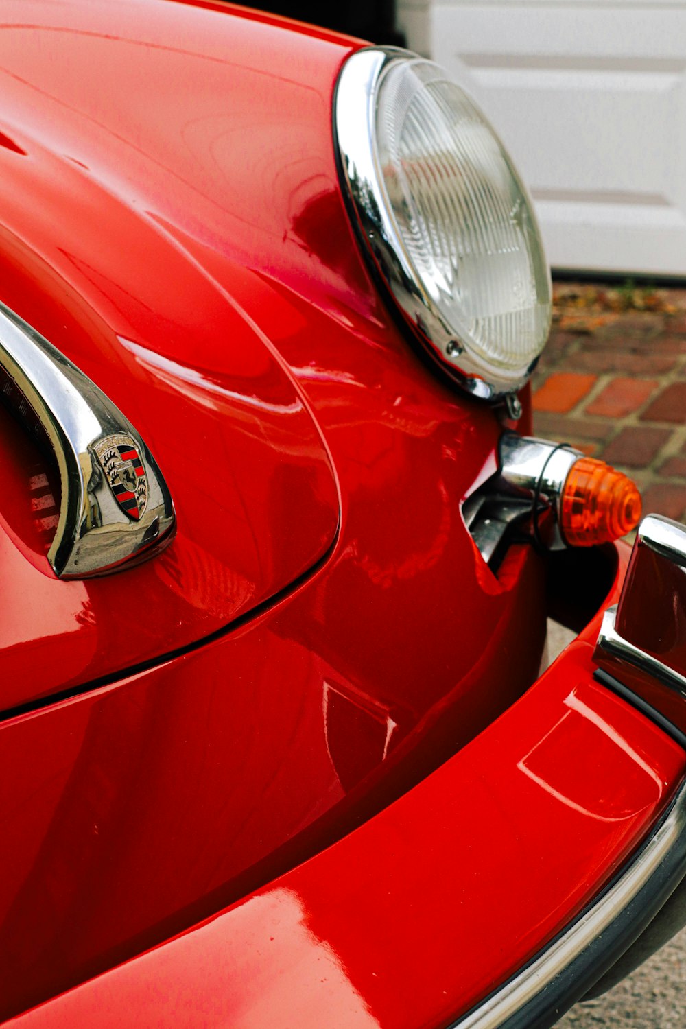 a close up of the front of a red car