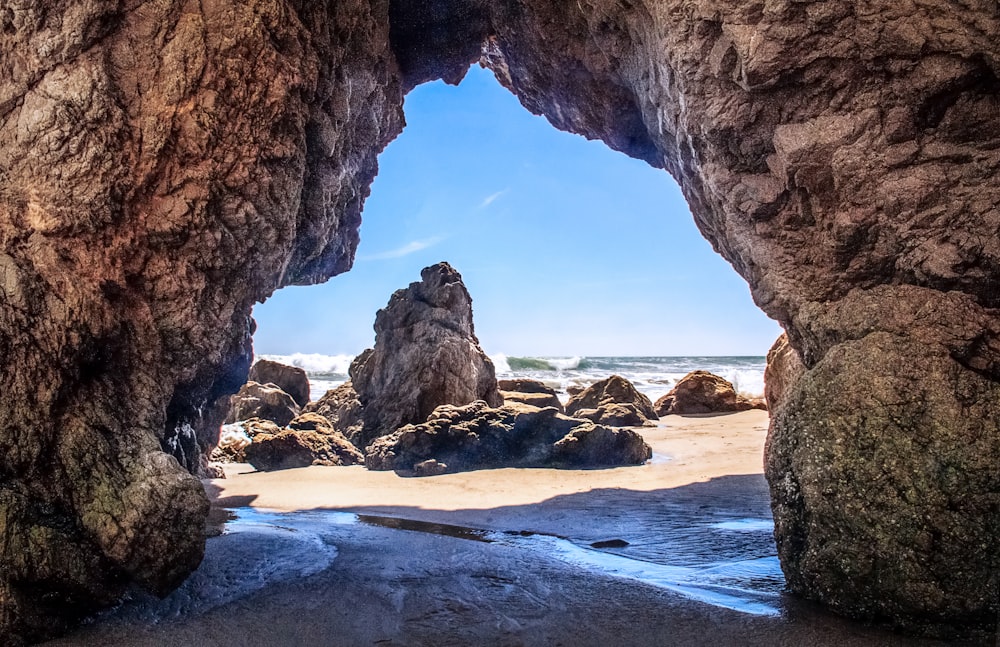 a view of the ocean from inside a cave