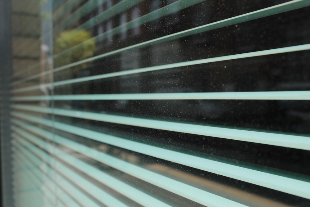 a close up of a closed window with blinds