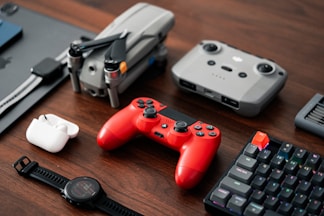 a close up of a table with a controller and a keyboard