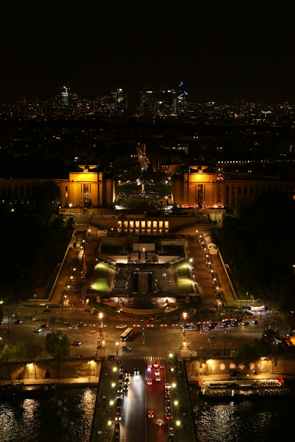 a view of a city at night from the top of a building