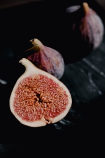 Ripe figs sliced open to reveal their rich, textured interior.
