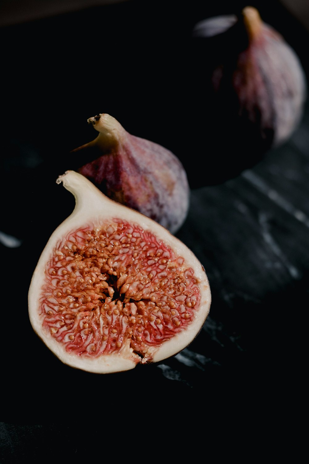 a couple of figs sitting on top of a table