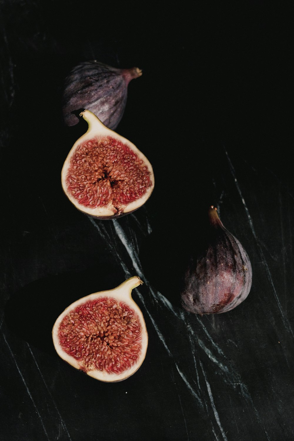 a couple of figs sitting on top of a table