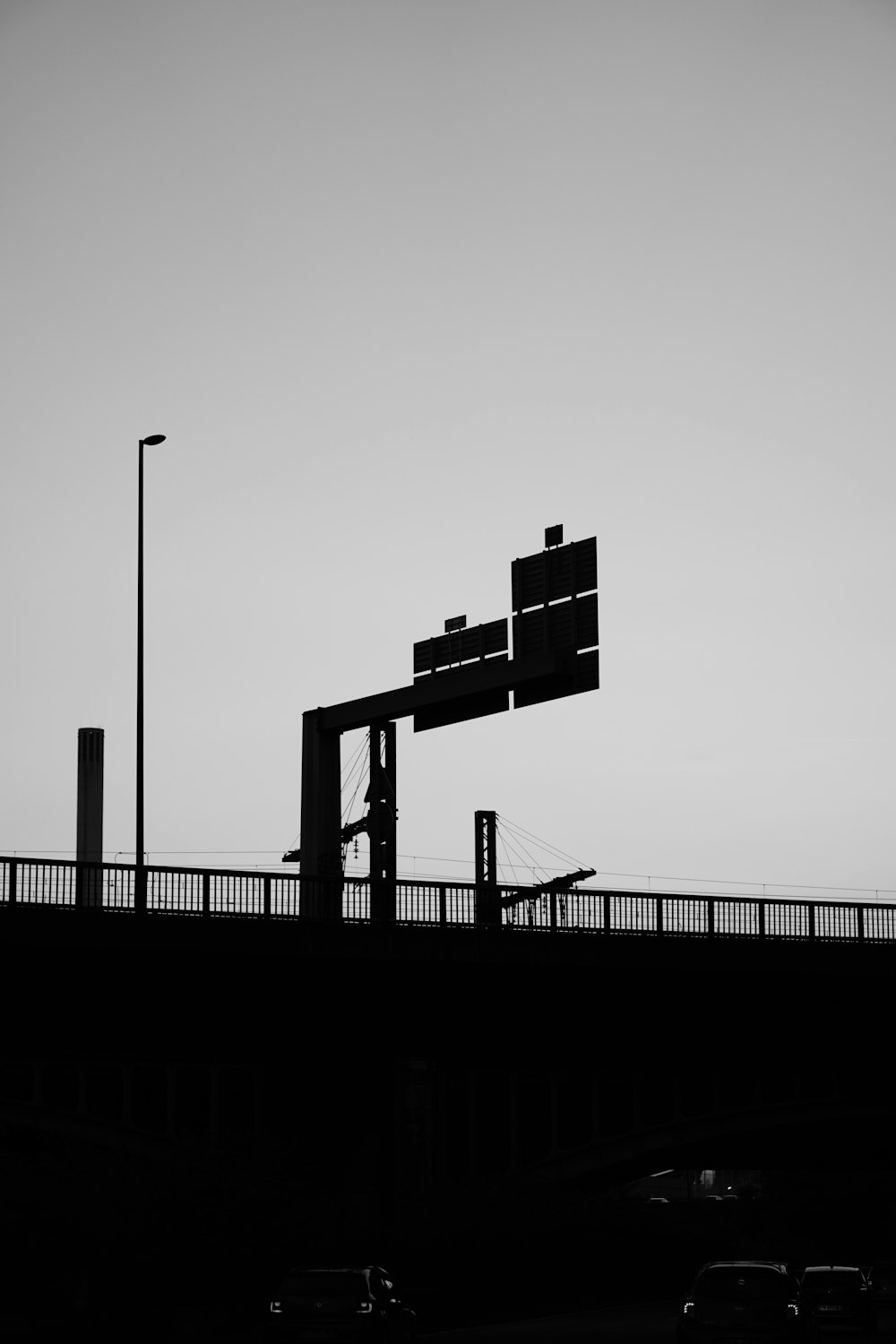 a black and white photo of a traffic light