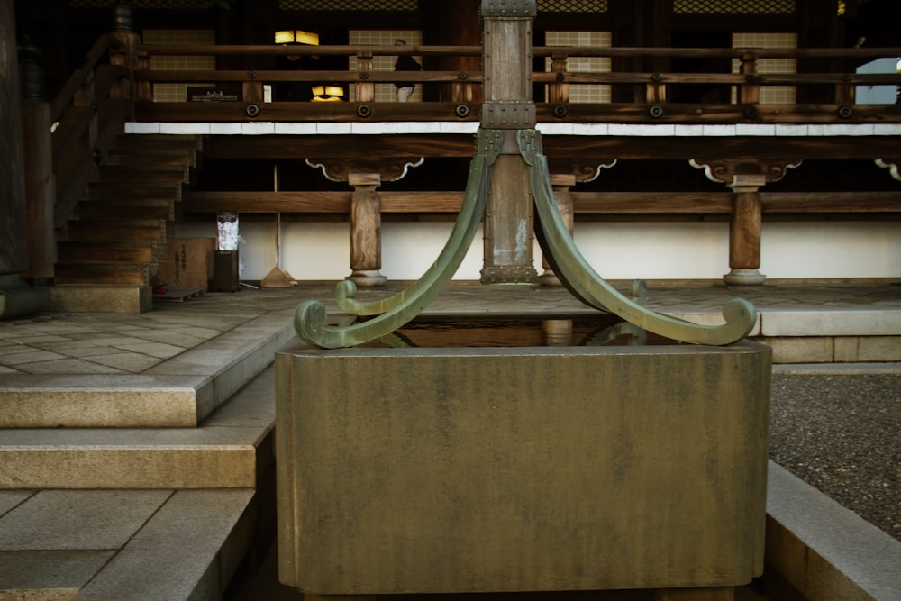 a large metal object sitting on top of a wooden platform