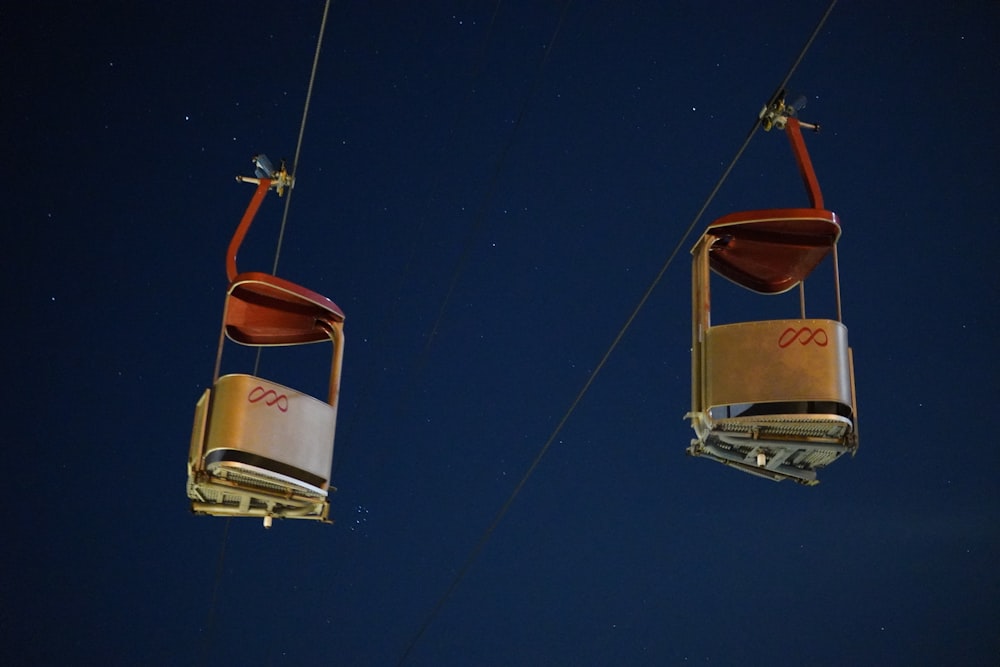 a couple of chairs that are suspended in the air