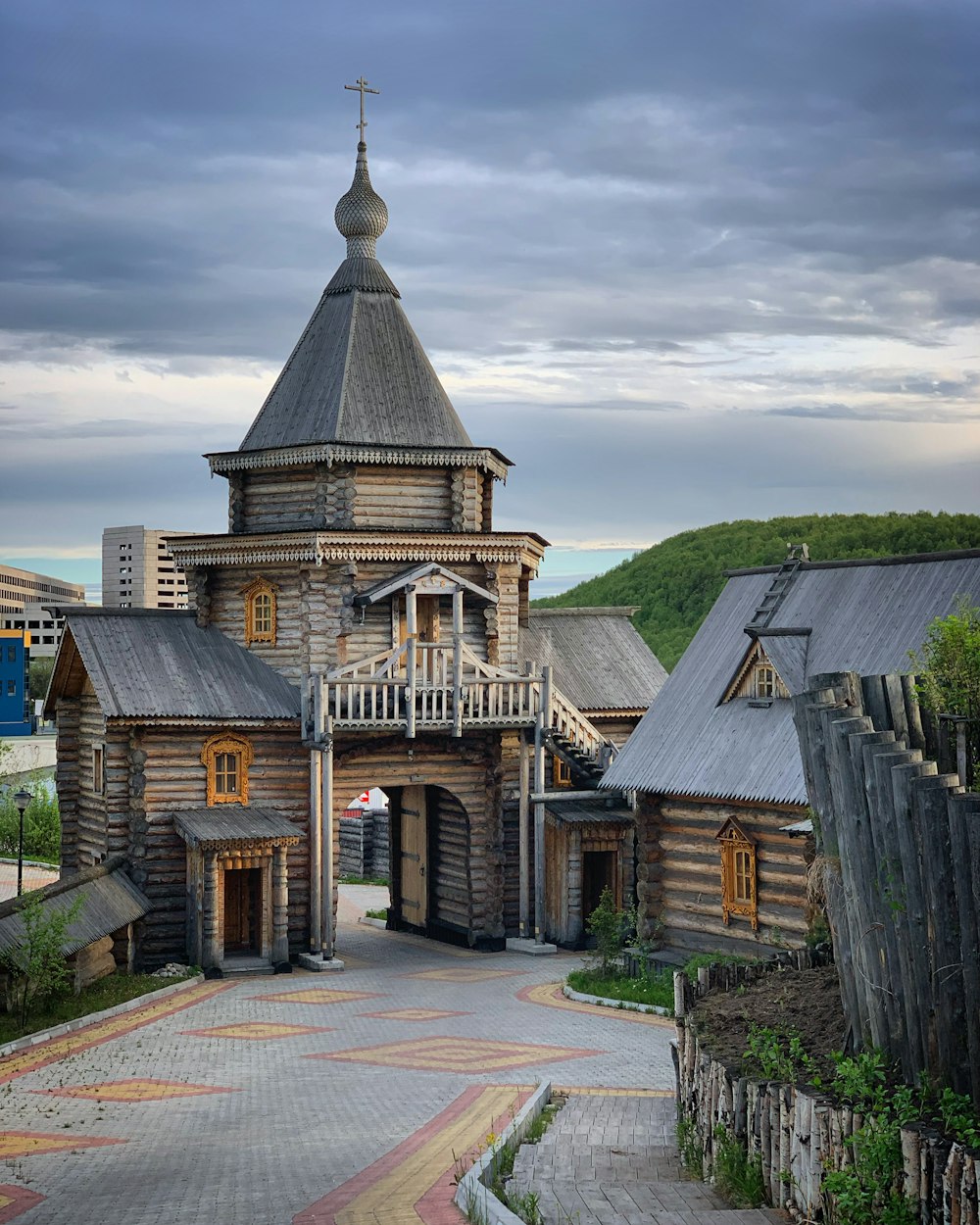 a wooden building with a steeple on top of it