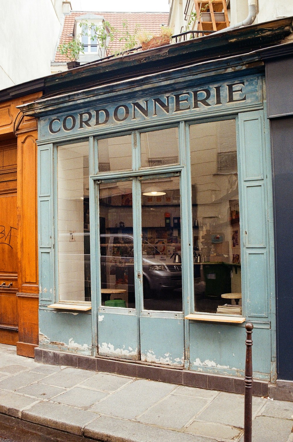 a store front with a car in the window