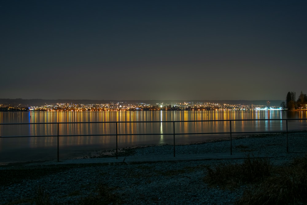 a night view of a city and a body of water