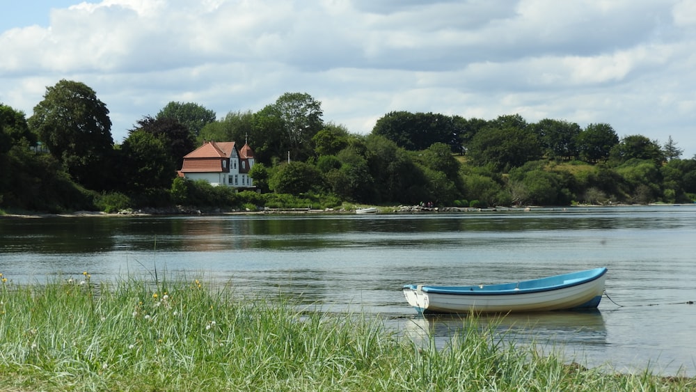 a small boat floating on top of a lake