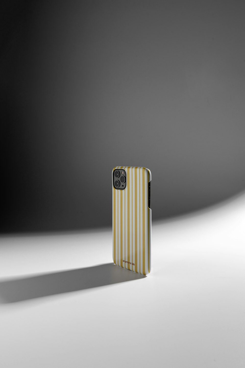 a yellow and white striped case sitting on top of a table