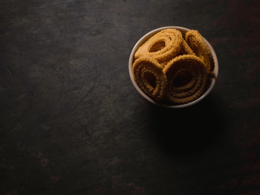 a bowl filled with some kind of food on top of a table