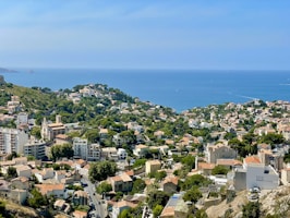 a view of a city with a body of water in the background