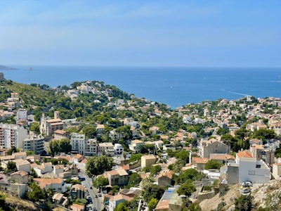 a view of a city with a body of water in the background