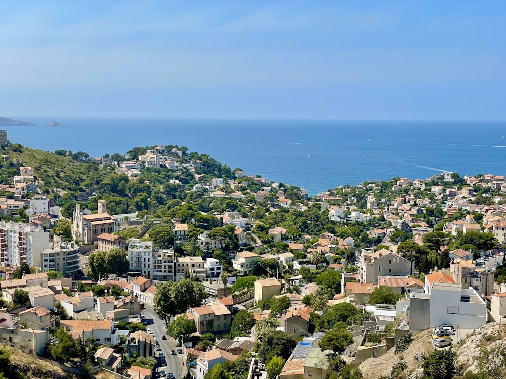 a view of a city with a body of water in the background