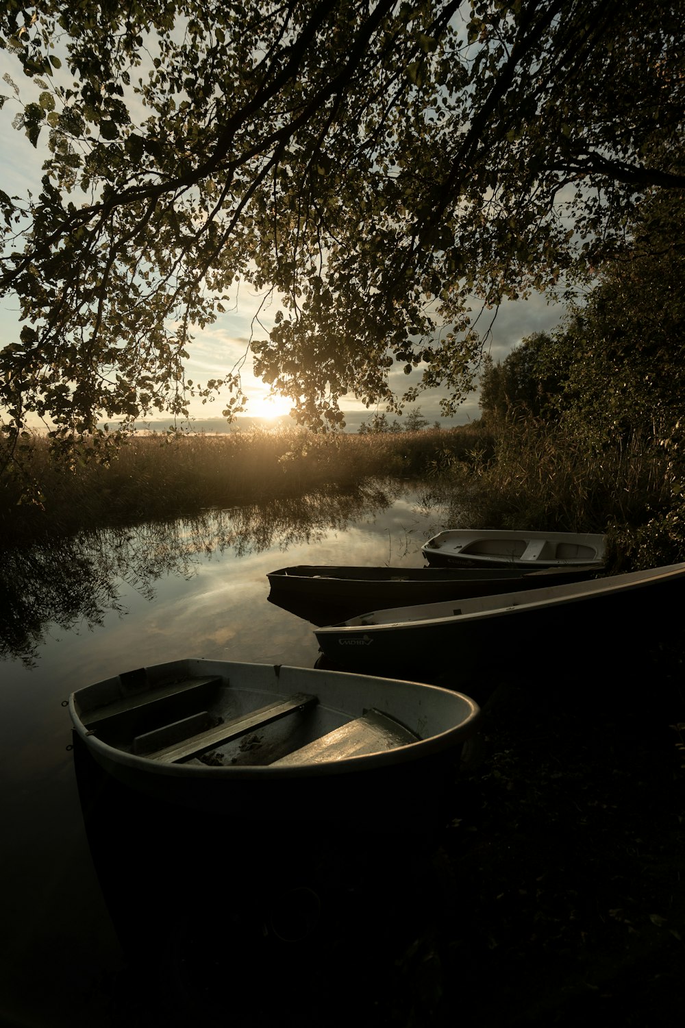 a couple of boats that are sitting in the water