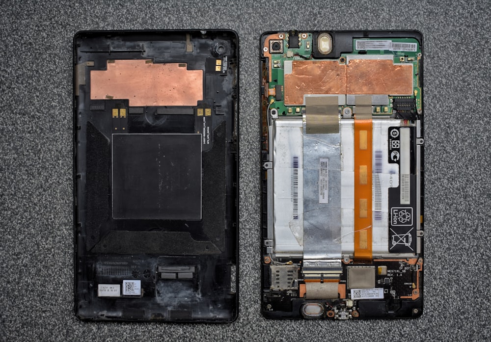 a cell phone with a broken battery attached to it