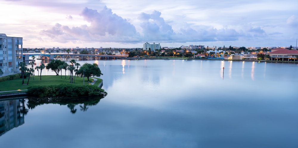 a body of water with a city in the background