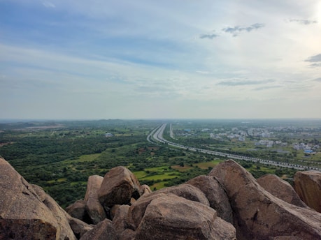 a view of a highway from the top of a mountain