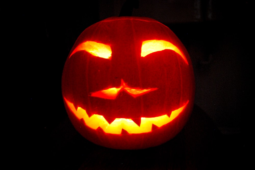 a carved jack o lantern in the dark