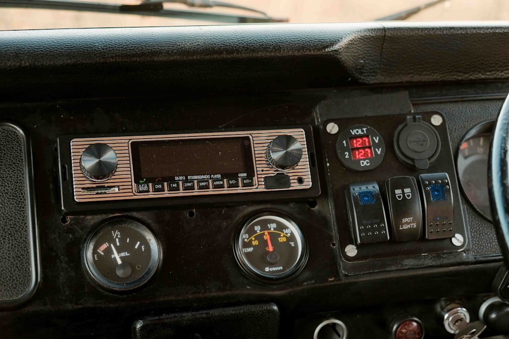 a dashboard of a car with a steering wheel